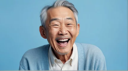Fotobehang young japanese elderly man on plain bright blue background laughing hysterically looking at camera background banner template ad marketing concept from Generative AI © sevenSkies