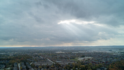 Sunbeam coming through a pocket in the clouds onto a town