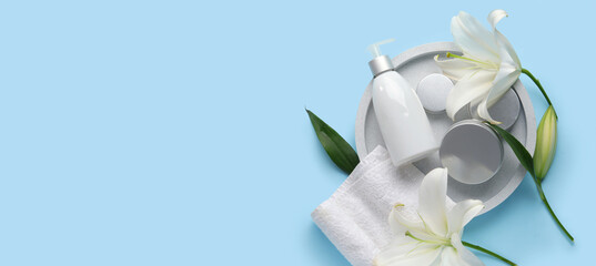 Composition with different cosmetic products, clean towel and beautiful lily flowers on color background
