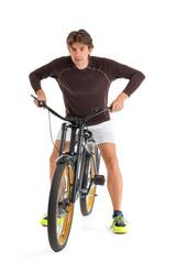 Young male cyclist riding bicycle on white background