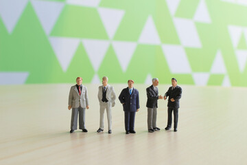 a small figures of business man meeting