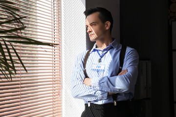 FBI agent looking in window at office