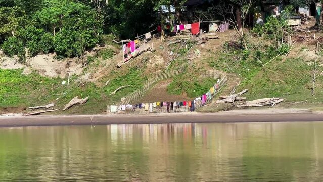 People living by the Sangu River dry their laundry on the fences. Bandarban, Bangladesh.