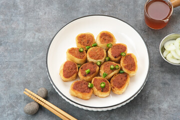 Gohyong or Ngo Hiang, made from minced chicken with flour, served with sour sauce
