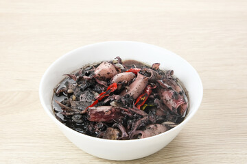 Squid Black Soup (Tumis Cumi Hitam) or stir-fried squid in black ink, Indonesian traditional food
