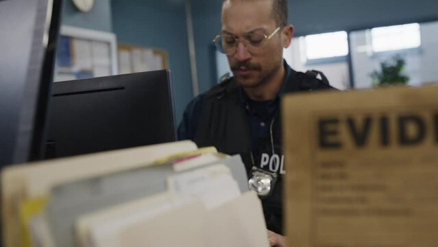Black african american police officer and files in the station