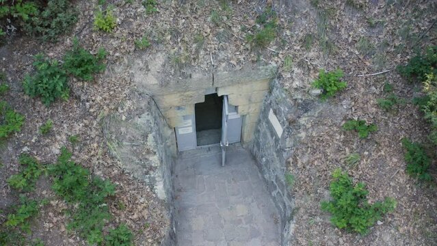 Entrance Door To Mezek Tomb In Bulgaria. - aerial descend shot