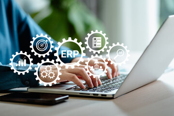 Businesswomen using a laptop with icon virtual Enterprise resource planning (ERP) concept, software...