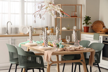 Beautiful table setting for Easter celebration in kitchen