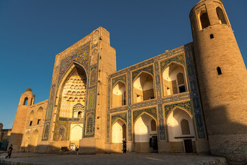 Fototapeta na wymiar View of the dome and tower of Poi Kalon Mosque in Bukhara, Uzbekistan.