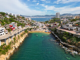 Drone Photo of La Angosta Beach in Acapulco, Tranquil Seaside Area and clouds - obrazy, fototapety, plakaty