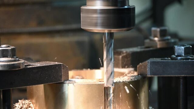 The plunge cutting process on NC milling machine with brass material parts by flat end mill tool.