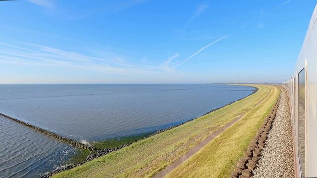 Train running along the Hindenburg dam in Sylt Westerland in a sunny day