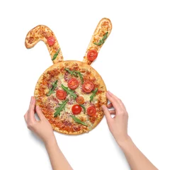 Keuken spatwand met foto Female hands decorating Easter pizza with bunny ears isolated on white background © Pixel-Shot