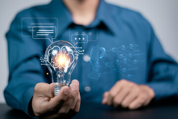 AI Chatbot intelligent digital customer service. Artificial intelligence automatically respond to online messages to help customers instantly. Businessman holding light bulb with chatbot icon.