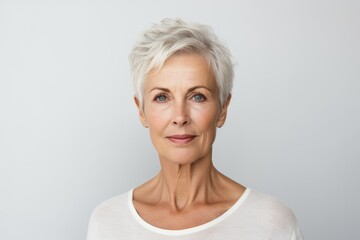 Portrait of beautiful senior woman with grey hair looking at camera.