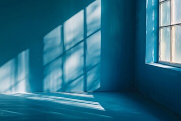 Obraz premium Abstract background with shadows of window on blue wall