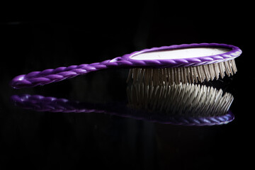 a hair comb isolated on a black background