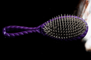 a hair comb isolated on a black background