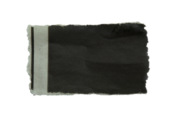 Torn black newspaper