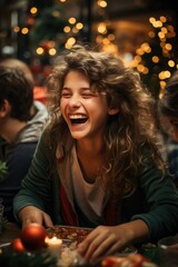 a young woman is sitting at a table laughing
