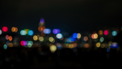 Blurred Photo cityscape at night with bokhe abstract background,Background concept.