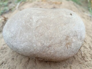 stones on the sand, big stone stone on road