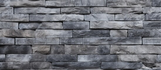 Detailed view of a sturdy wall composed of interconnected gray blocks of stone, showcasing a solid and durable construction