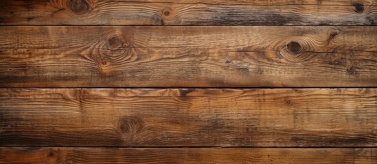 A closeup of a brown hardwood plank flooring with a grainy texture, showcasing the natural wood...
