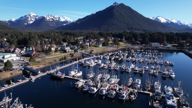 4k 23.98fps aerial video of beautiful downtown Sitka, Alaska, and the small boat harbor.  Captured March 2024.