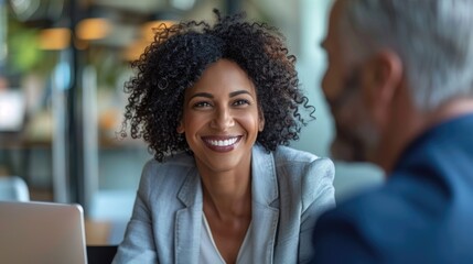 Confident professional woman meeting with banker for financial services consultation description:The image depicts a confident and