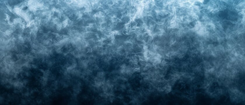   A blue and black background with some clouds in the image's center, or a black background with clouds in the middle of the image