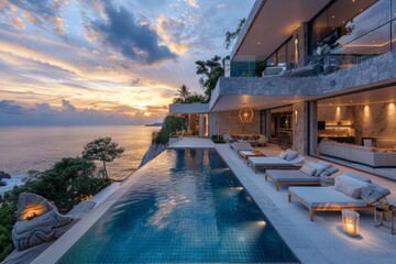 Luxury modern house with infinity pool and outdoor living area by the sea