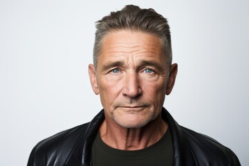 Portrait of a senior man in a leather jacket looking at the camera