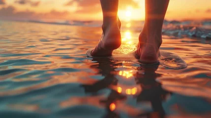 Fotobehang Closeup Bare feet tread shoreline as the sun sets, reflecting on the water 3d illustration © Pungu x