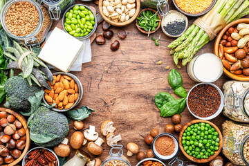 Vegan food background with empty space., frame. Plant protein., vegetarian nutrition sources. Healthy eating, diet ingredients: legumes, beans, lentils, nuts, soy milk, tofu, cereals, seeds 
