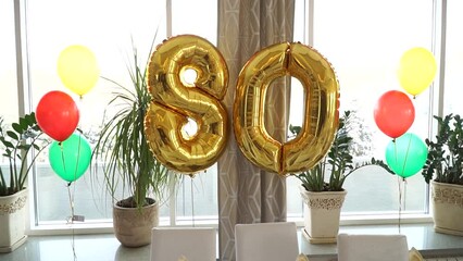 Festive table with balloons for the 80th anniversary