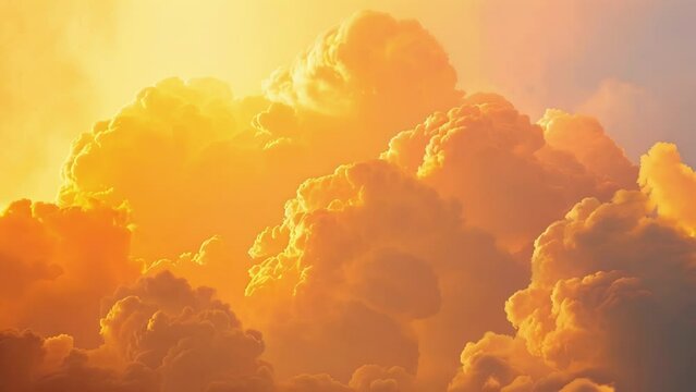 Majestic clouds backlit by the morning sun radiating in shades of pink orange and yellow.