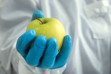 Vitamins are the key to our health: green apple in hand