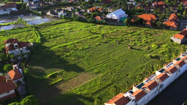 Aerial view of a prime land parcel in Bali, highlighting investment potential. Changgu and Seminyak area. Concept of investing in Bali real estate. 