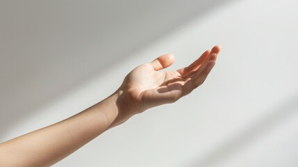 Reaching Hand Against Bright Light in Minimalist Style