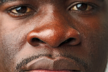 Close Up of African Mans Face With Brown Eyes