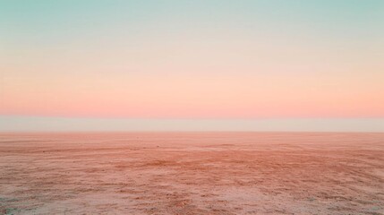 A serene expanse of dusty rose sand stretching towards a hazy apricot horizon under a pale peach sky. - obrazy, fototapety, plakaty