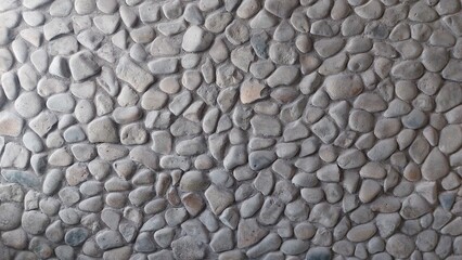 A wall of cobblestones of a different color