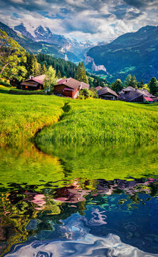 Beautiful summer scenery. Small pond in outskirts of Wengen village. Splendid summer scene of countryside in Swiss Alps, Bernese Oberland in the canton of Bern, Switzerland, Europe .Travel the world.