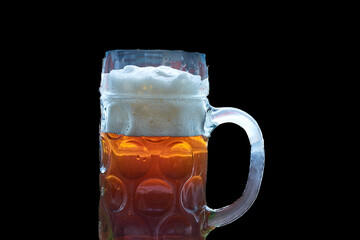 A mug of toasted beer with a black background