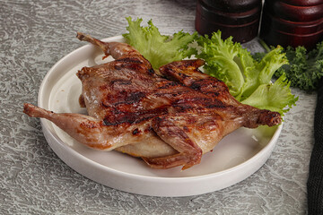 Grilled quail in the plate