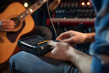 Keuken foto achterwand Muziekwinkel musician storing songs on a portable music recorder