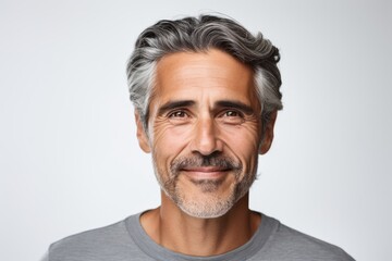 Portrait of handsome mature man with grey hair and beard on grey background - obrazy, fototapety, plakaty