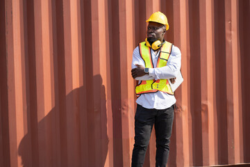 African logistic engineer man worker or foreman working with container at container site	 - 768518759